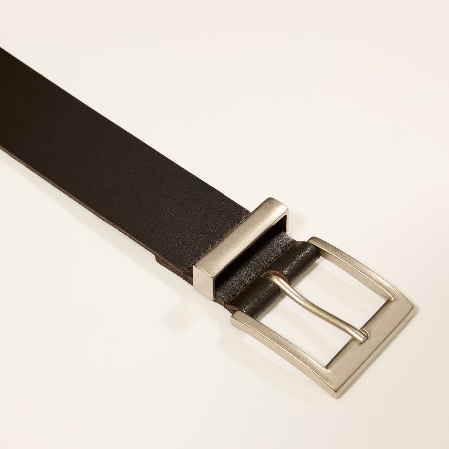 Detail of the buckle and keeper of a dark brown belt